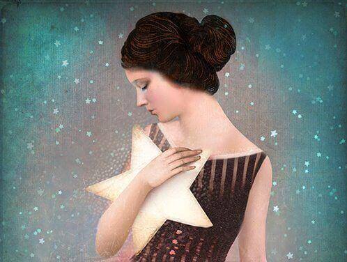 Kvinne holder stjerne