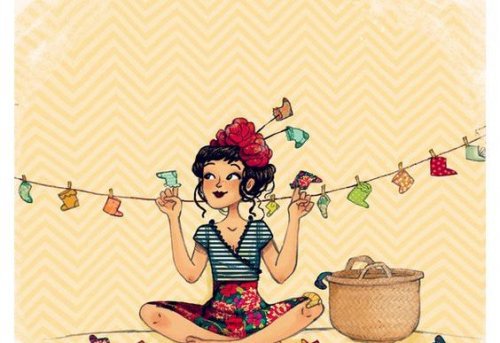 kvinne henger opp klær