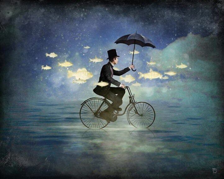 Mann på sykkel med paraply Christian Schloe