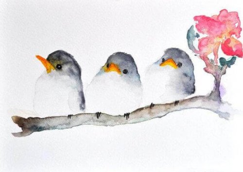 Fugler sitter på en gren